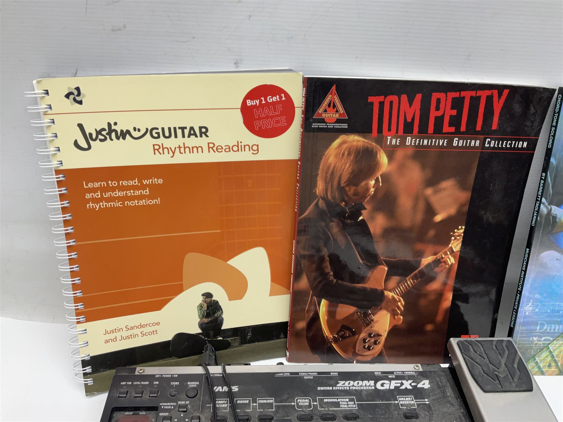 Zoom GFX-4 Guitar Effects processor; quantity of assorted cables; tremolo arms; plectrum wallet; Steepletone SMH10 earphones etc