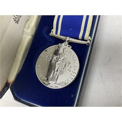 Archive of memorabilia and ephemera relating to Pc. (later Sgt.) Geoffrey Robinson of Dewsbury (later West Yorkshire) police force including cased Long Service and Good Conduct Medal; helmet plates and cap badges, collar numbers and uniform buttons, whistles, certificates, photographs, plaque etc 1960s - 1990s