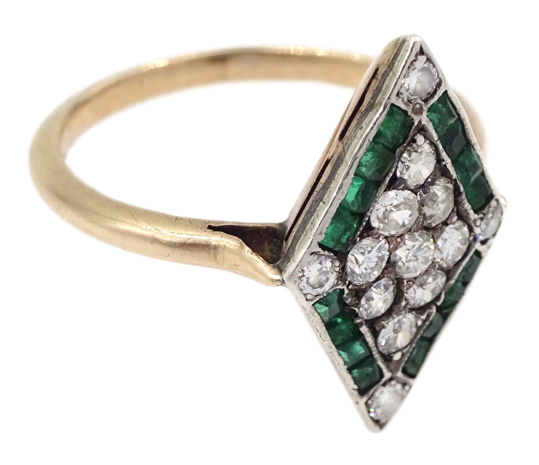 Gold diamond and emerald kite shaped cluster ring, nine old cut diamonds, with calibre cut emerald and diamond set border
