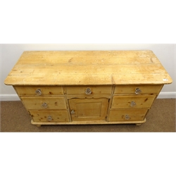  Victorian stripped pine dresser base, seven drawers, single cupboard, turned supports, W138cm, H81cm, D52cm  