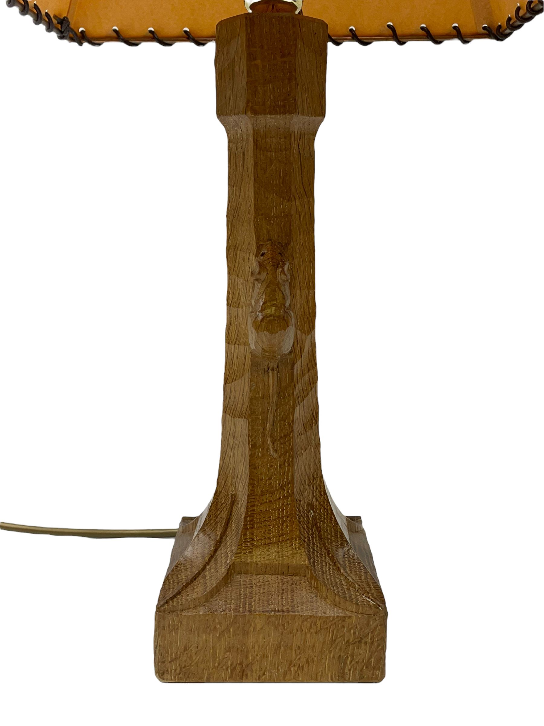 'Mouseman' tooled oak table lamp, the octagonal tapered stem carved with mouse signature, with shade, by Robert Thompson of Kilburn