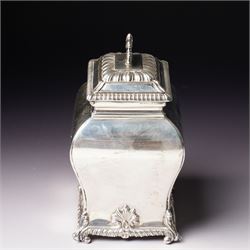 Edwardian silver tea caddy of bombe outline with shell moulded finial, shell moulded and gadrooned base on scroll feet H15cm London 1902 Maker Thomas Bradbury & Sons