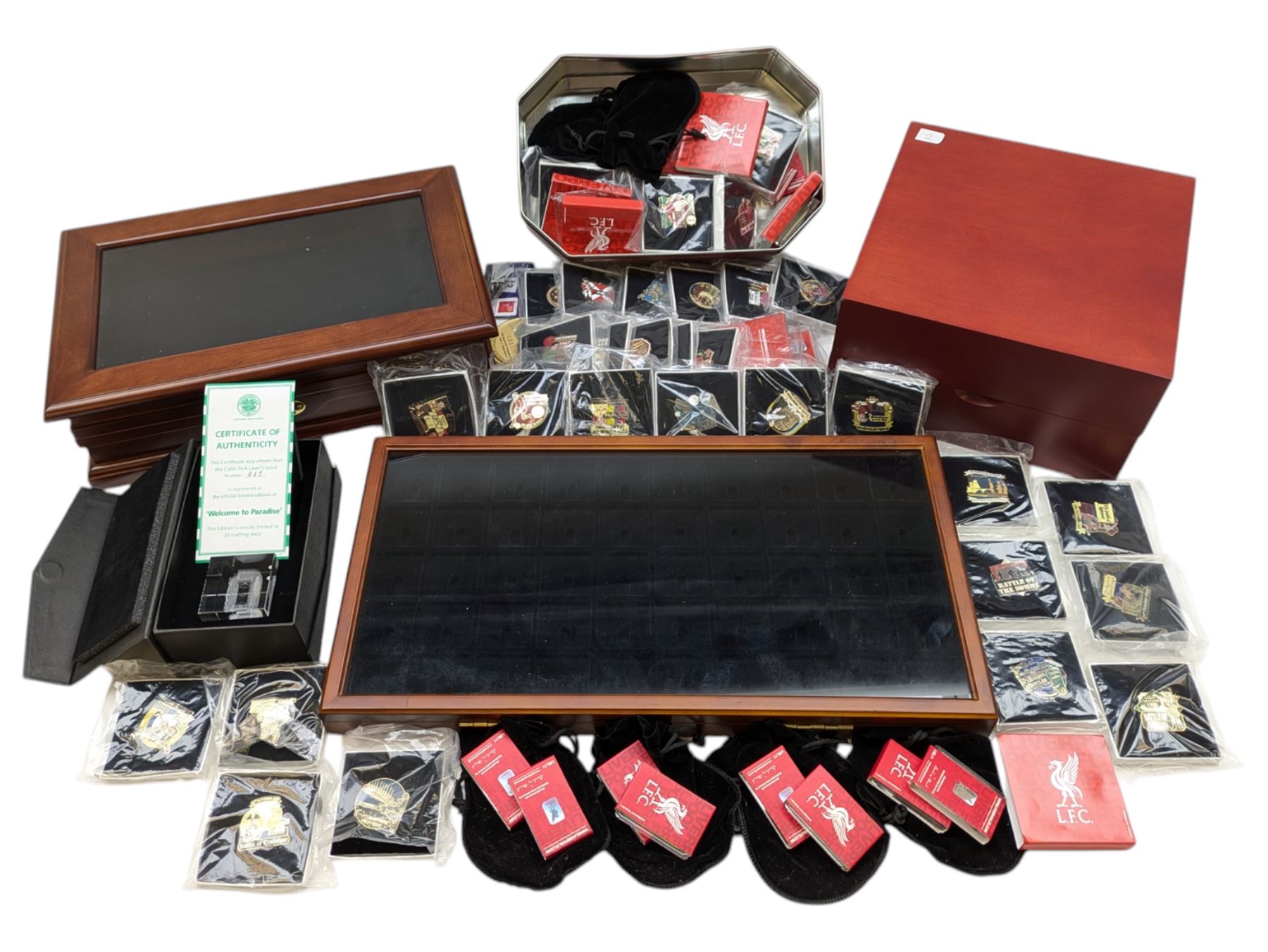 Mostly collectable pin badges and memorabilia, including various L.F.C (Liverpool Football Club) badges produced by the Danbury Mint, various ingots from the 'Golden Games' collection, 'The Battle of Minden', 'The Battle of Waterloo' and other similar pin badges, various display cases, 'Welcome to Paradise' Celtic Park laser crystal numbered 965 and other collectables