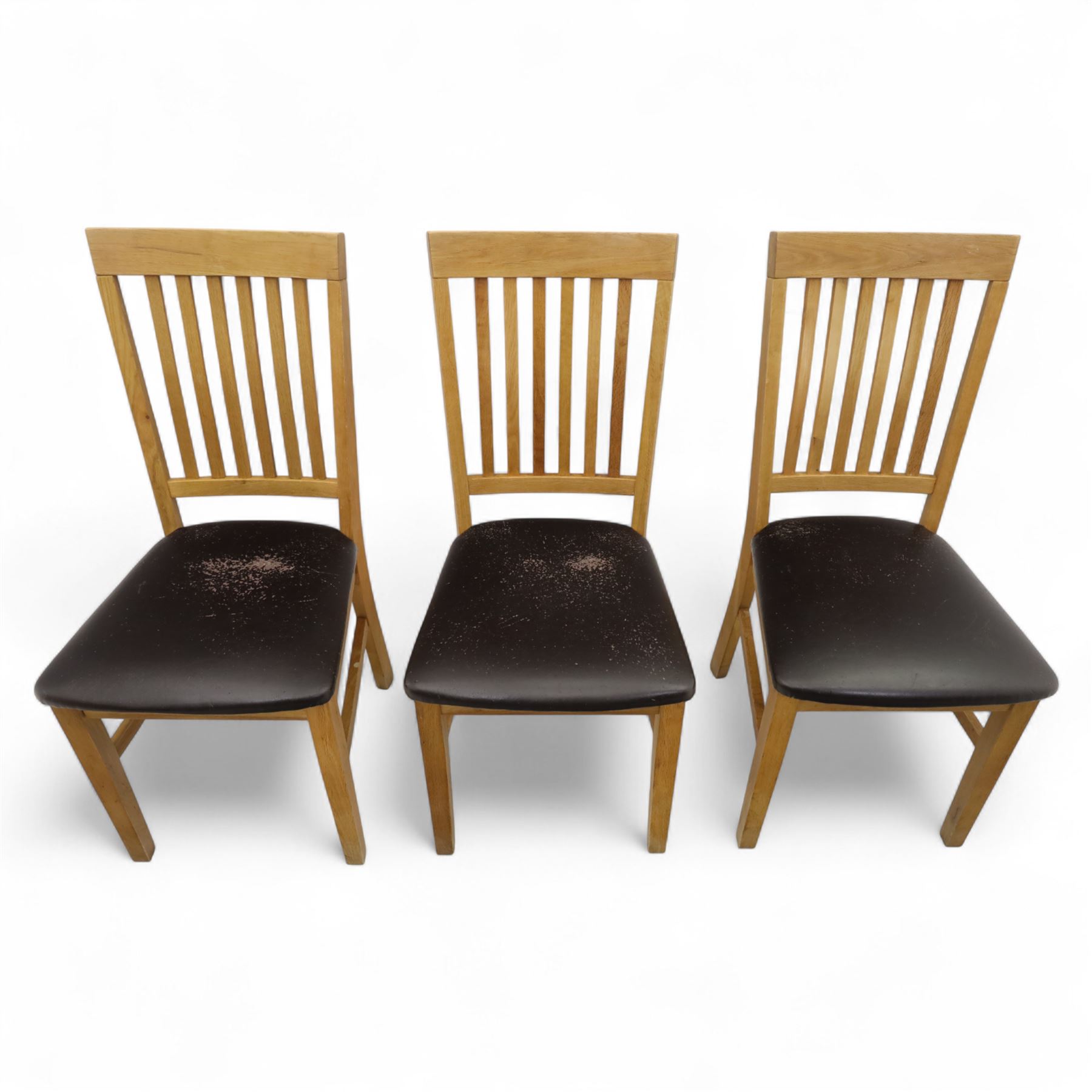 Contemporary set of six light oak dining chairs with faux leather cushion seats 