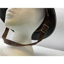 WW2 German steel helmet painted in undecaled Luftwaffe bluey grey with leather liner and chin strap stamped '58', the skirt impressed '1250'