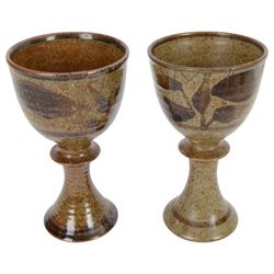 David Lloyd Jones (1928-1994): set of four studio pottery goblets, with foliate decoration on a mottled brown ground, together with two small stoneware bowls by the same artist, with stylised bird border on an orange brown ground, all with impressed marks beneath, goblets H15.5cm