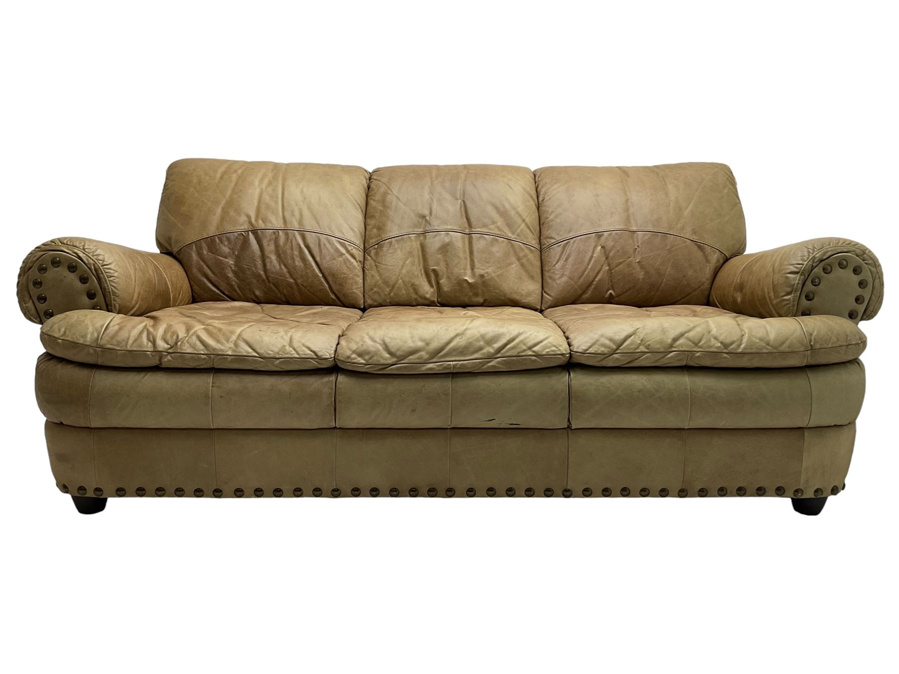 Large three-seat sofa upholstered in stitched brown leather with stud work decoration, rolled back and arms