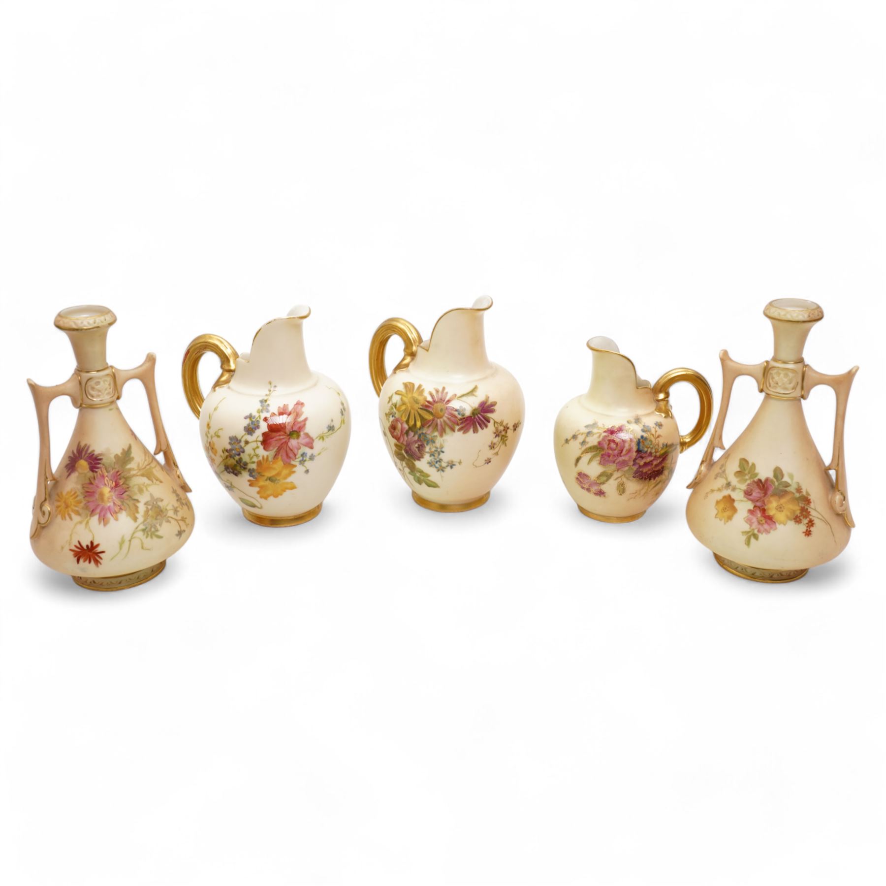 Royal Worcester blush ivory porcelain to include a pair of jugs, no. 1094, pair of vases, no. 1021, and a small ewer no. 1094 (5)