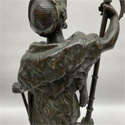 Pair of bronzed figure modelled as a hunter in traditional dress, each holding a pike, H48cm