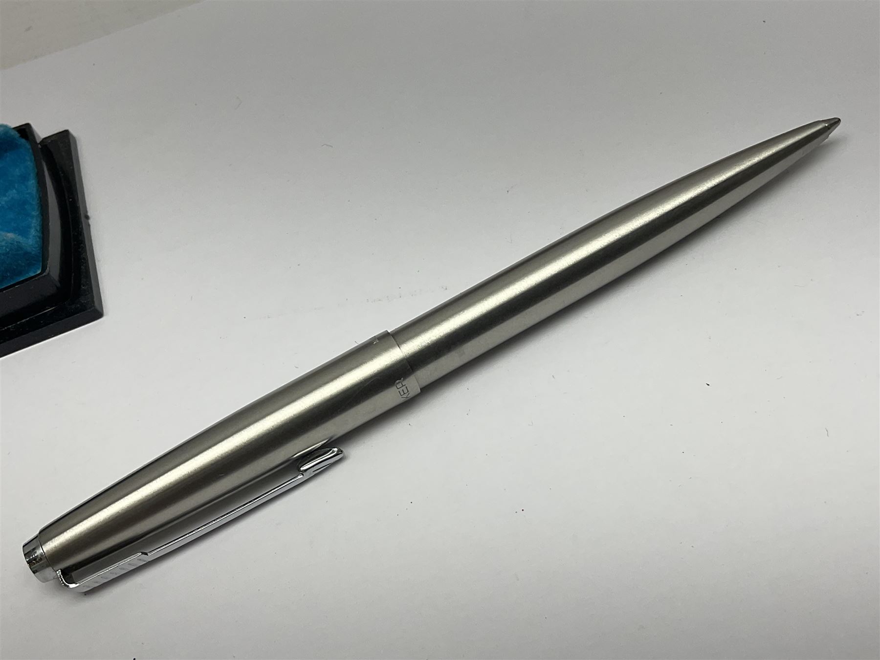 Three fountain pens, to include Conway Stewart 'Dinkie 550' and 'Conway 57' and a Parker 'Slimfold', all with 14ct gold nibs, together two roller ball pens, including a Parker example and a Swarovski Crystal paperweight