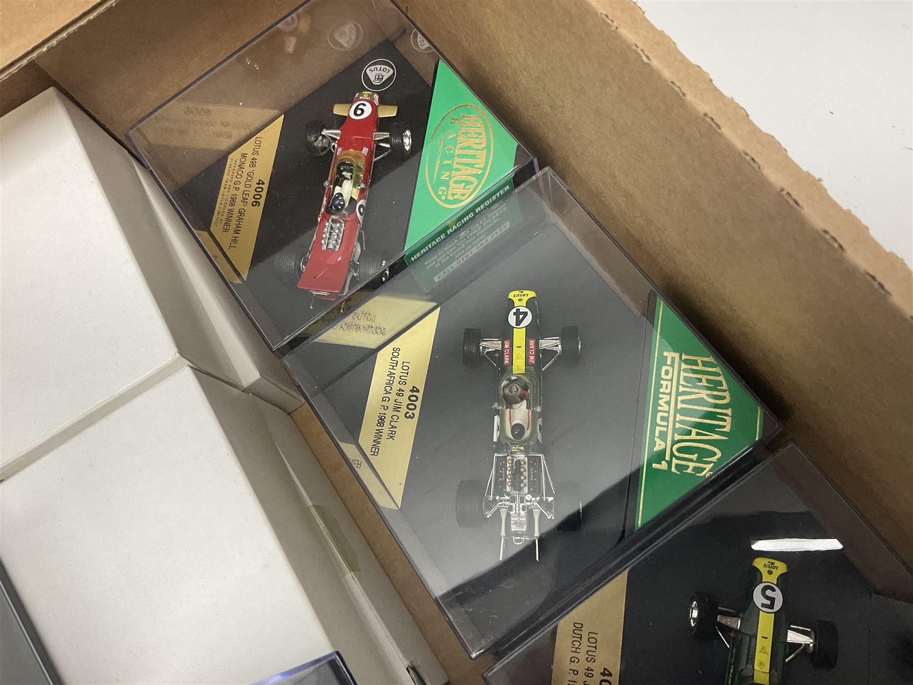 Heritage - thirty-five die-cast model racing cars comprising twenty-five Heritage Formula 1 1:43 scale models including Ferrari, Lotus, Yamaha etc; and ten Special Edition models including Williams Renault Ayrton Senna, David Coulthard and IndyCar, etc with certificates; and a Heritage Classics Damon Hill helmet; all in display boxes, many with original packaging (36)