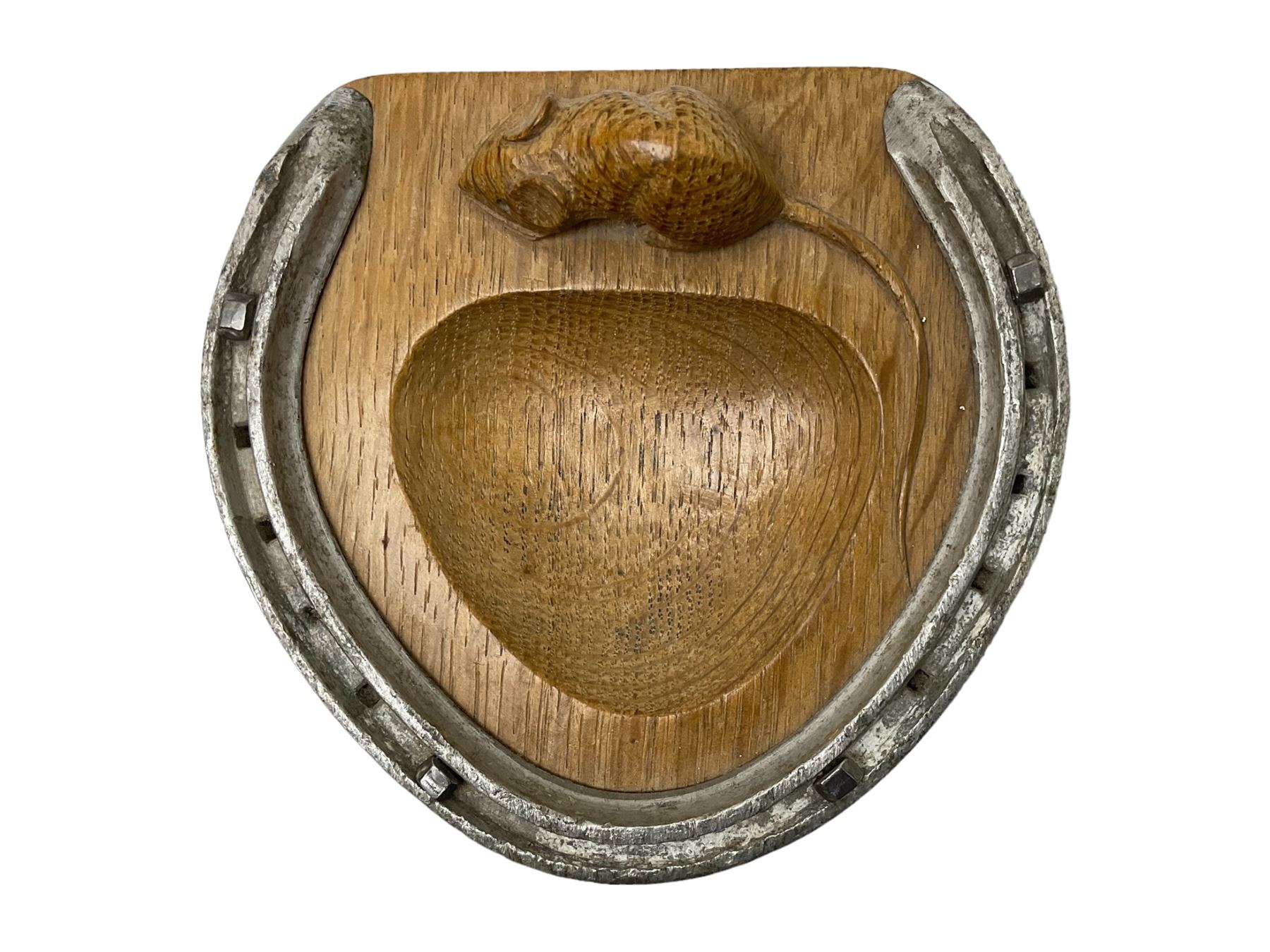 Mouseman - oak horseshoe ashtray, rounded triangular form with mounted horseshoe, carved with mouse signature, by the workshop of Robert Thompson, Kilburn, L13cm