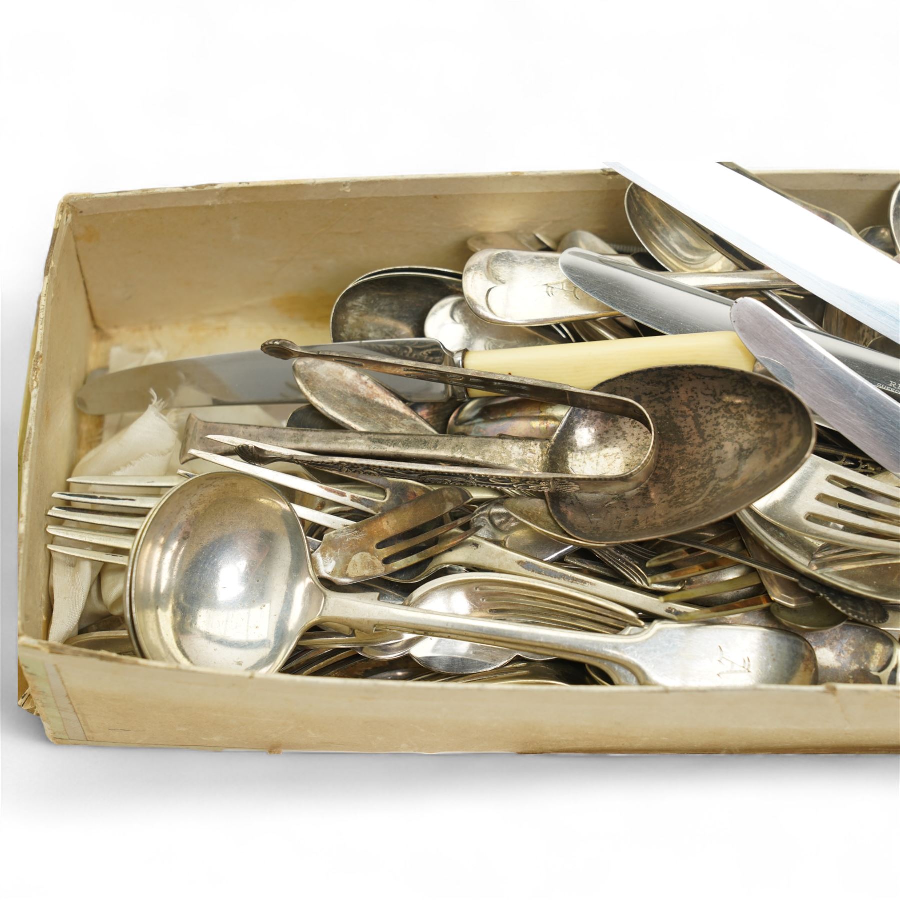 Quantity of plated cutlery, pair of silver sugar tongs, Georgian silver spoon etc