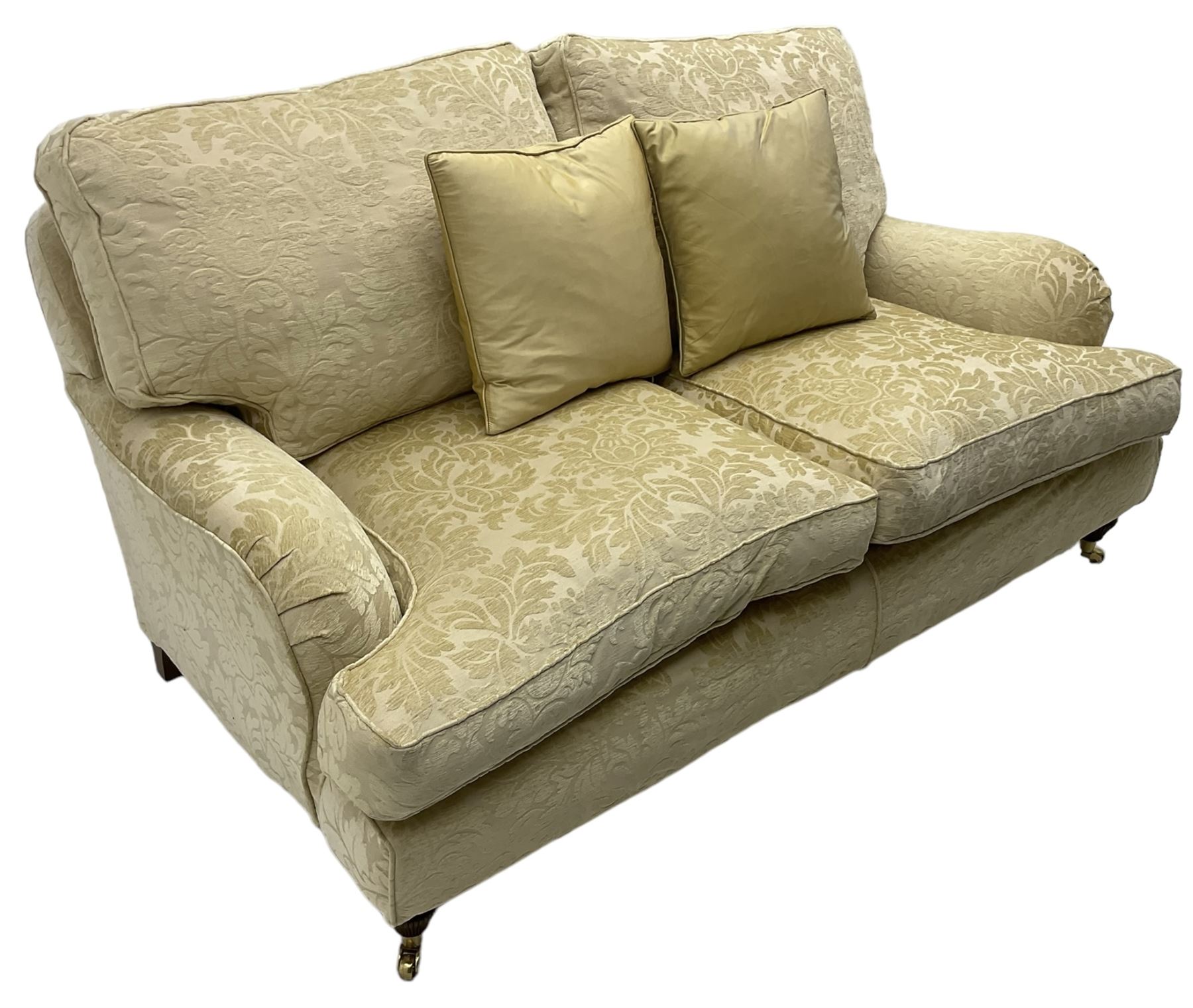 Multi-York - Howard shape two-seat sofa, upholstered in scrolling floral pattern loose covers, rolled arms, on turned front feet with brass cups and castors
