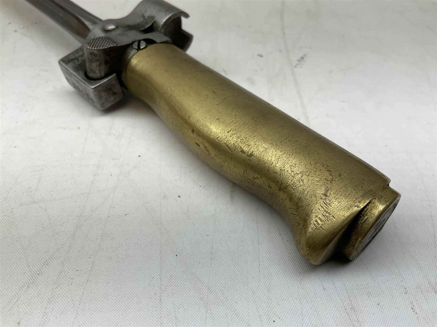 French Lebel Model 1886/93/16 bayonet with 52cm steel cruciform blade and brass hilt No.R22136; in steel tapering round scabbard numbered A62918 L65.5cm overall