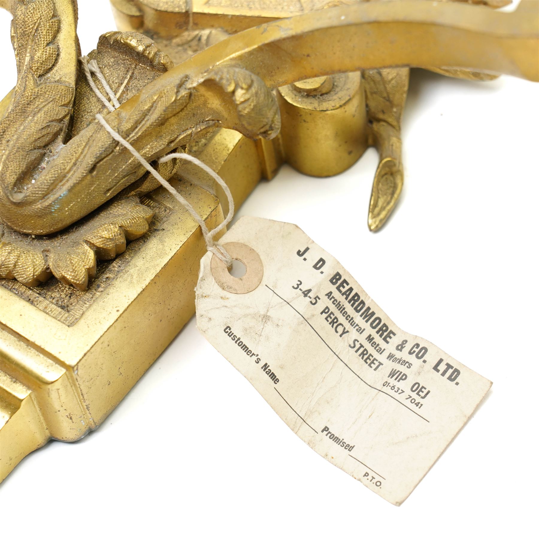 Period design gilt brass wall light, by Beardmore, London, with French empire motifs, including a helmet, oak leaves and acorns, quiver, each arm with acanthus leaf decoration, wired for electricity, with original label, H36cm  
Provenance: property of a Nobleman