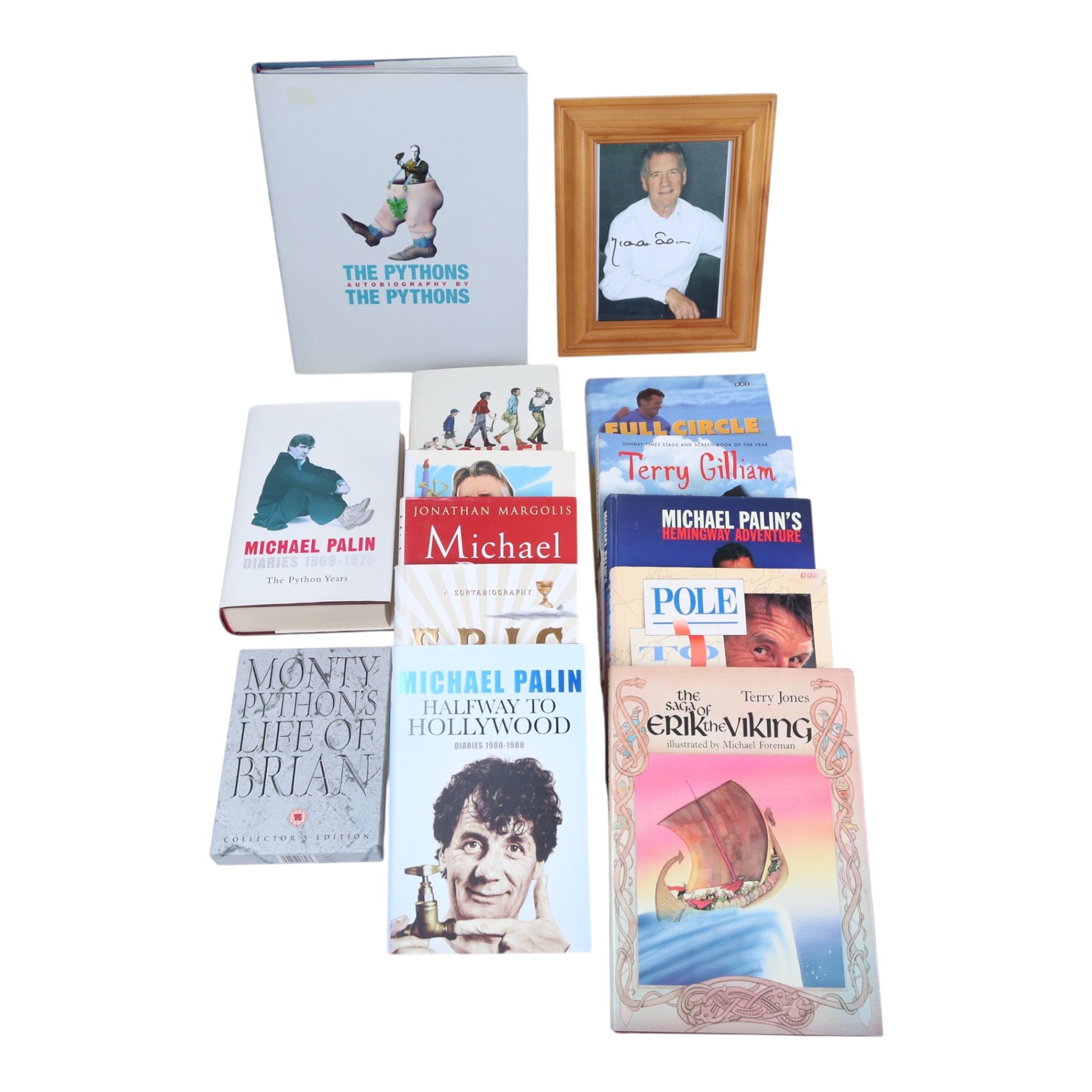 Collection of Michael Palin books, to include 'Travelling to Work - Diaries 1988-98' 'Hemingway Adventure' and 'Pole to Pole'; together with signed photo and 'Monty Python's Life of Brian' DVD 