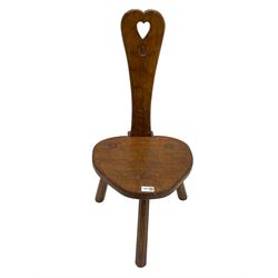 Acornman - adzed oak spinning chair, spoon shaped back with pierced heart and acorn signature, spade-shaped seat raised on octagonal tapering supports by Alan Grainger of Brandsby
