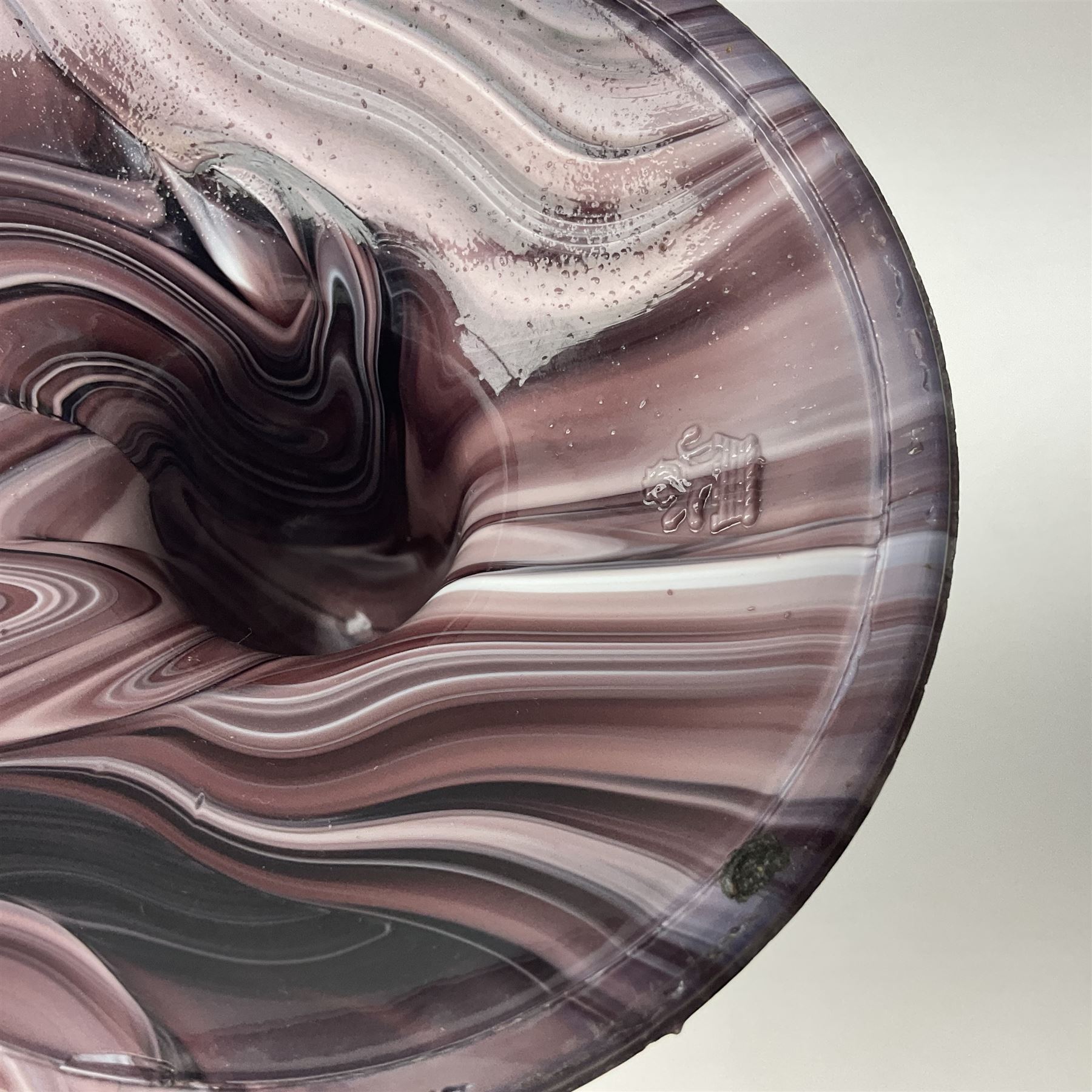 Daum glass two stemmed candle stick signed to verso, together with a pair of slag glass purple candle sticks, Daum H21cm