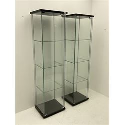 Pair of floor-standing four sided glass display cabinet, four glass shelves 