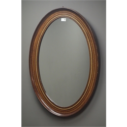  Edwardian oak inlaid oval mirror, W61cm, H87cm  