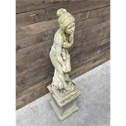 Cast stone garden figure of a bathing lady, raised on square plinth