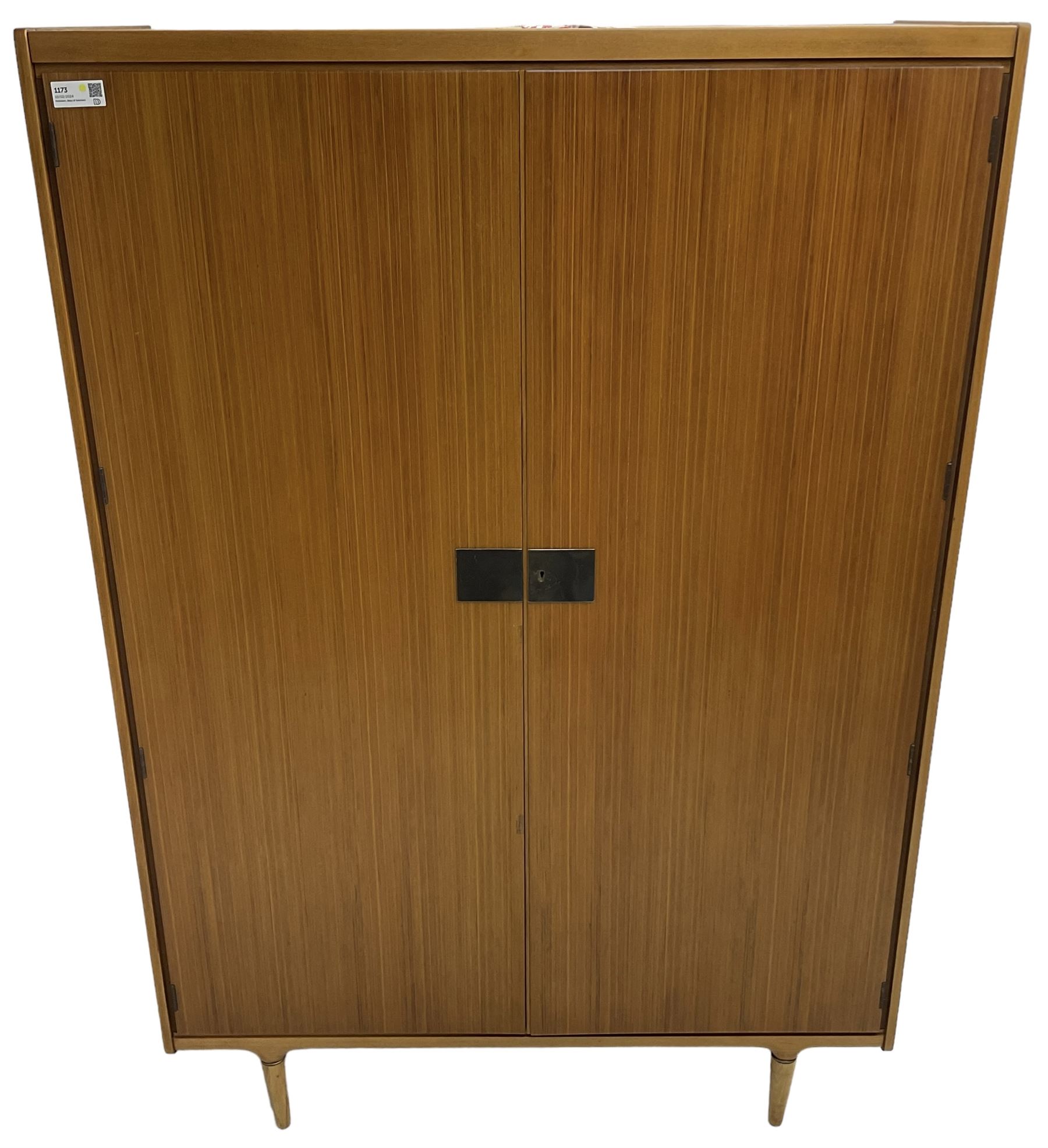 Wrighton - mid-20th century teak wardrobe, two doors enclosing hanging rail, shelves and hinged compartments, on turned tapering feet