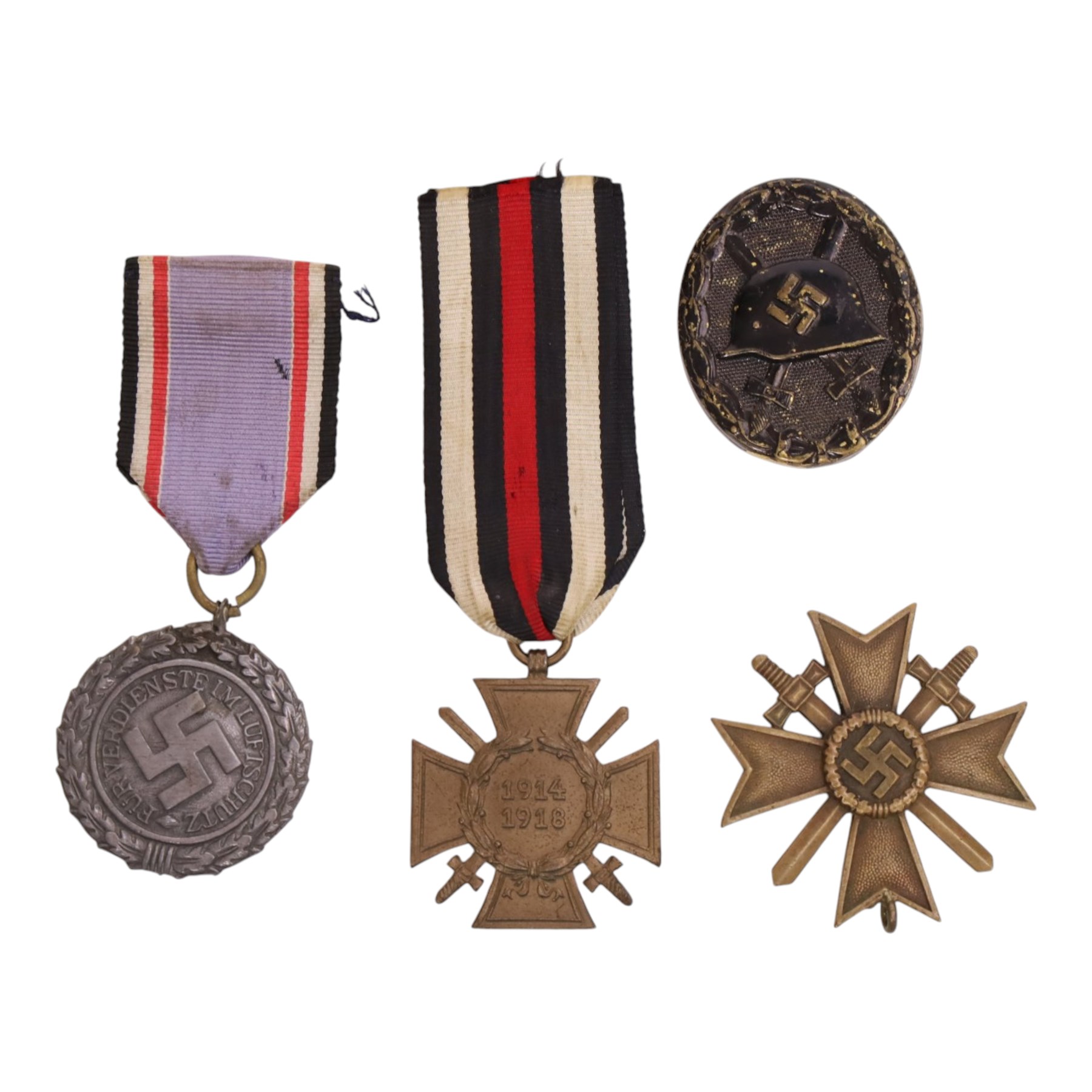 WWI German Hindenburg cross, together WWII bronze Merit Cross with crossed swords, Luftschutz Civil Defence medal and German Wound Badge 
