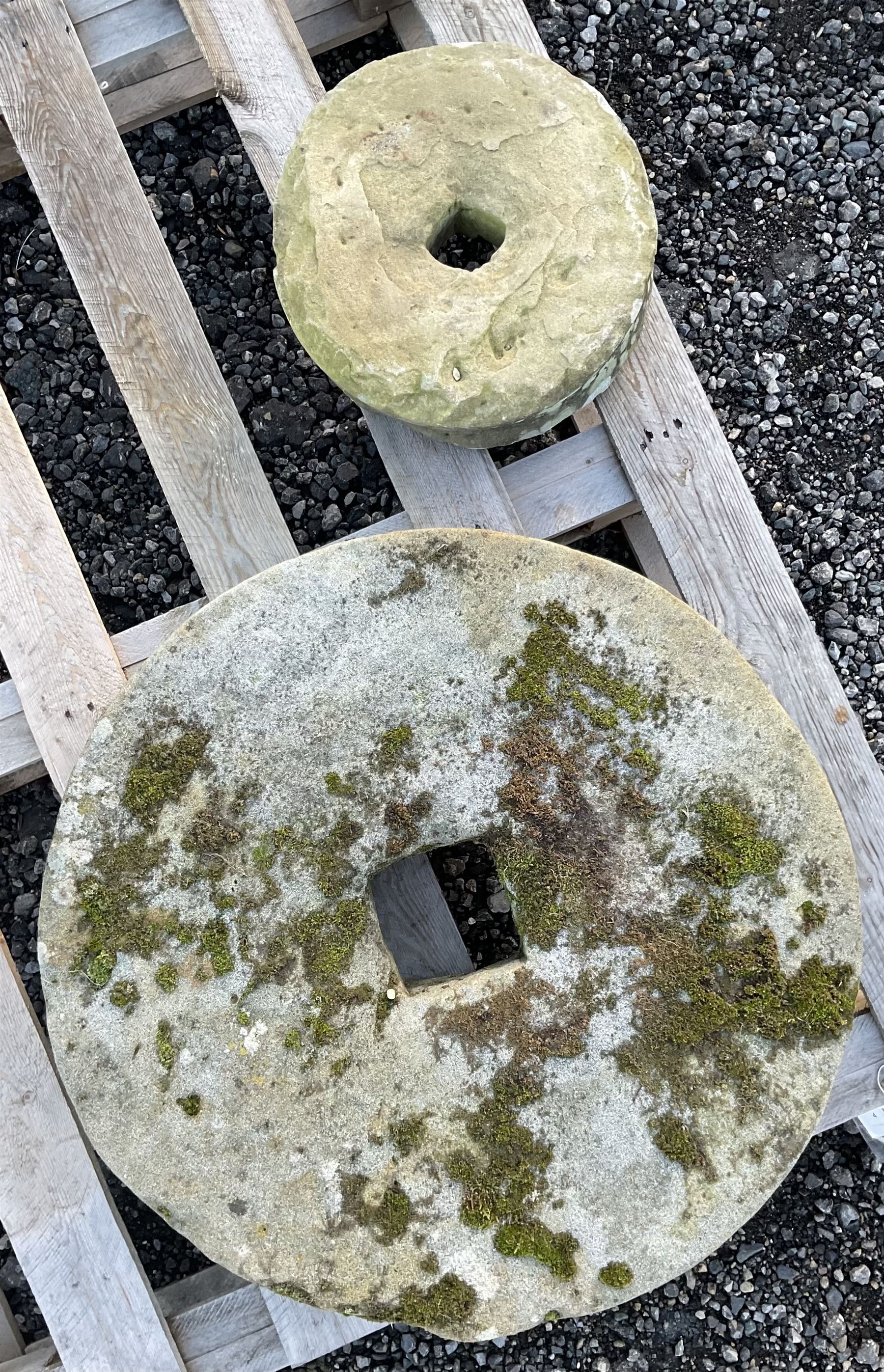 Two 19th century stone mill wheels D64cm and D33cm - THIS LOT IS TO BE COLLECTED BY APPOINTMENT FROM DUGGLEBY STORAGE, GREAT HILL, EASTFIELD, SCARBOROUGH, YO11 3TX
