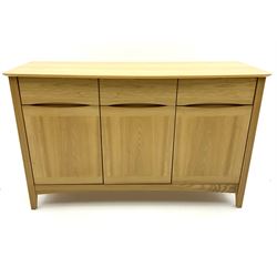 Light oak sideboard, fitted with three long drawers, above three cupboards enclosing fitted shelving pan stile supports 