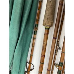 Four split cane fly fishing rods, three made by Burn of Selsdon, the four unmarked, housed in rod bags and a card tube