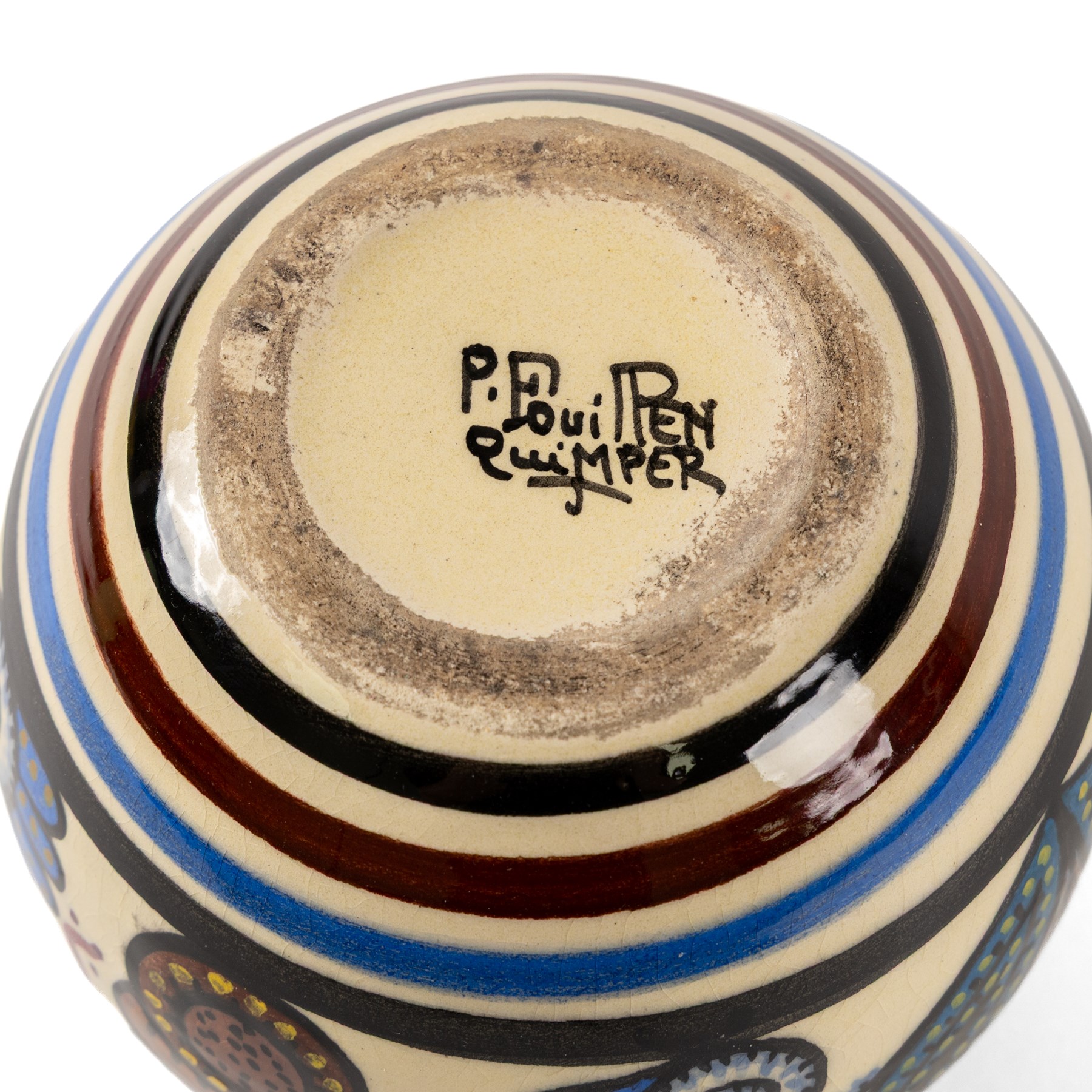 Paul Fouillen for Quimper pottery, decorated with stylised flowers, in blue and purple tones in cream tones, H14cm