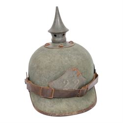 WWI Prussian 22nd regiment Ersatz Felt Pickelhaube, the grey felt skull with steel spike finial, 22 helmet plate and leather chin strap, one side with a black cockade, the other black and red,  the inner back brim stencilled BA 1X Wm Kleddinghaus & C, Elberfeld, 1916, H24cm