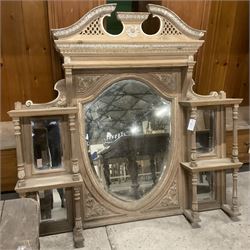 Late 19th century pine and gesso mirror back or wall mirror, pierced broken swan neck pediment decorated with foliate and central flower head motif, shield shaped bevelled mirror, the spandrels decorated with scrolled foliate decoration, two tier shelves on turned and fluted supports  - THIS LOT IS TO BE COLLECTED BY APPOINTMENT FROM THE OLD BUFFER DEPOT, MELBOURNE PLACE, SOWERBY, THIRSK, YO7 1QY