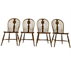 Set of four light elm stick back chairs, figured Windsor splat back, saddle seat, crinoline stretcher base