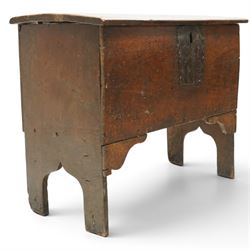 Small 17th century six plank oak coffer, figured top with iron pintle type hinges,  pegged boarded sides, large lock plate with rivets, plank ends continuing down as supports