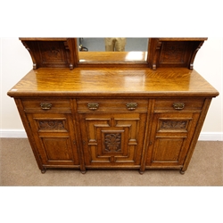  Victorian oak mirror back sideboard, floral carved cresting rail, three piece bevel edge mirror back, turned supports, three drawers above three cupboards, W150cm, H214cm, D54cm  