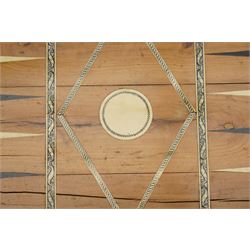 Mid-19th-century Anglo Indian Vizagapatam ivory, sandlewood, and horn veneered backgammon/chess board, circa 1860, rectangular games box the borders engraved with a stylized scrolling leaf decoration and spine engraved History of Persia the interior inlaid for backgammon, with three internal sandalwood boxes with covers, containing 16 ivory pieces and 16 horn pieces, comprising, kings and queens with pierced crowns on baluster carved shafts; bishops with carved mitres; knights represented by horses’ heads; and rooks as towers with imbricated decoration.

This item has been registered for sale under section 10 of the APHA Ivory Act, submission reference G68PNYA5 

