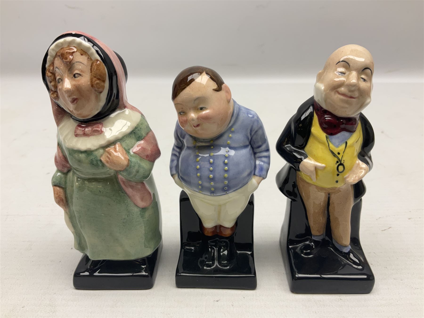 Sixteen Royal Doulton Charles Dickens figures, to include Oliver Twist, Fat Boy, Fagan, Stiggins etc, all with printed marks beneath