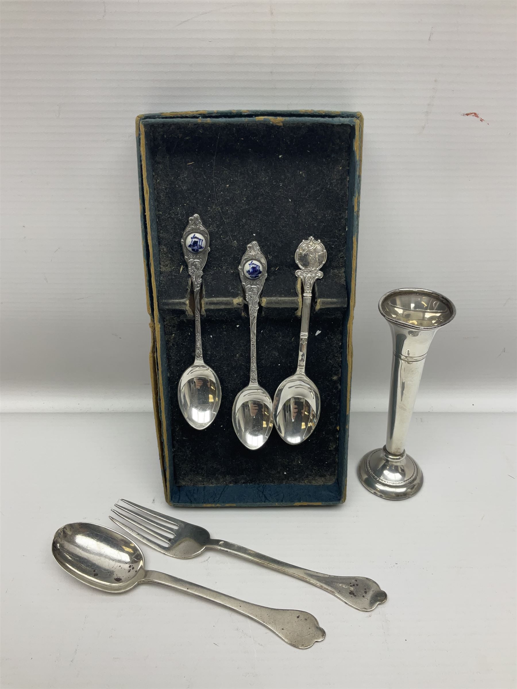 Silver plated tray, with shaped rim and embossed with a dog and crown to centre, stamped Valenti, together with three silver plated decanter labels, two port and one Bucellas, a plated cream jug with embossed floral decoration and a pair of plated fish knives engraved with double headed eagle to handle, tray W25.5