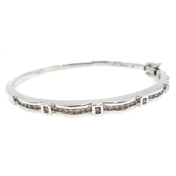  White gold scallop edge, channel set diamond hinged bangle, stamped 9k  