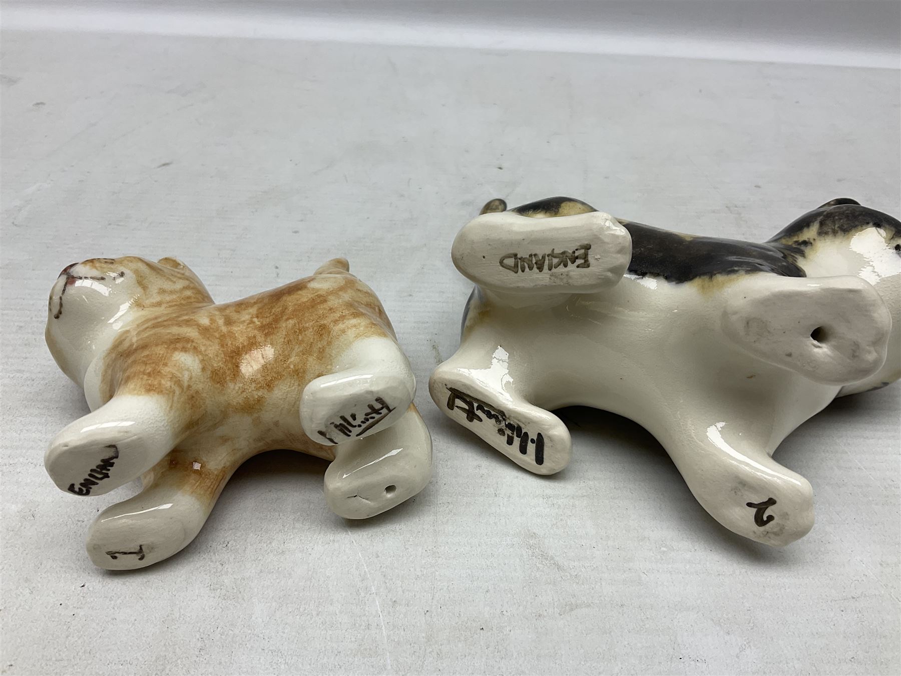 Two Winstanley figures of kittens, comprising tabby cat no 2 and ginger cat no 1, both with inset eyes and painted marks beneath, tallest H11cm