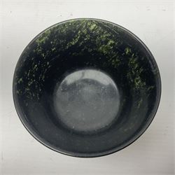 Polished hardstone footed bowl, together with another, possibly spinach jade, bowl, largest D12cm    