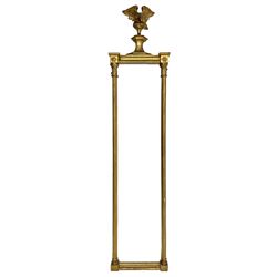 Regency gilt wood and gesso mirror, perched eagle on shape footed pediment, plain and narrow mirror plate flanked by fluted half columns