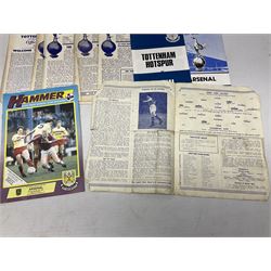 West Ham United - eight 1940s/50s home programmes for 1947/48 - 1951/52 and another for 1986/87 and two team photographs; together with eight Tottenham Hotspur home programmes 1952/53 - 1976/77 (17)