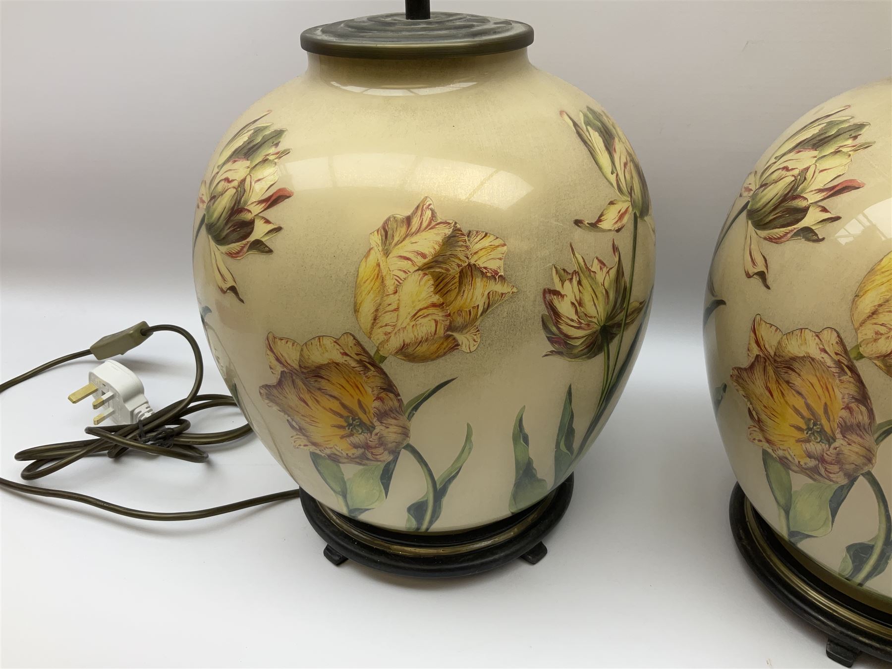Pair of Potichomania tulip design glass table lamps, by Jenny Worrall, H40cm, with cream pleated lampshades. 