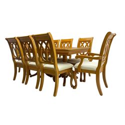 Yew wood extending twin pedestal dining table, rectangular top with ebony stringing over turned and reeded vasiform pedestals on tripod bases, with two additional leaves (W159cm D92cm); and set of eight (6+2) matching dining chairs, high pierced backs over seats upholstered in ivory fabric, on cabriole supports (W57cm H101cm)