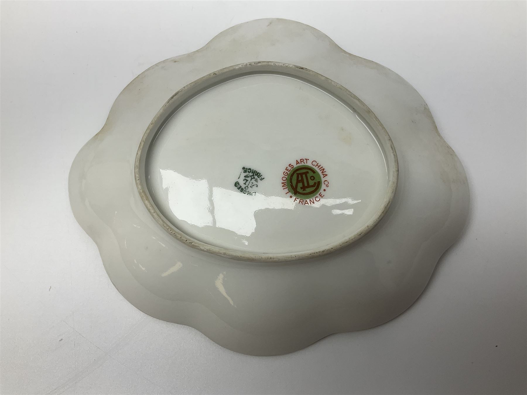 Royal Worcester blush ivory vase and cover, the vase of baluster form on gilt claw feet, shape No.1019, with printed beneath, Together with Limoges dish, vase H16cm