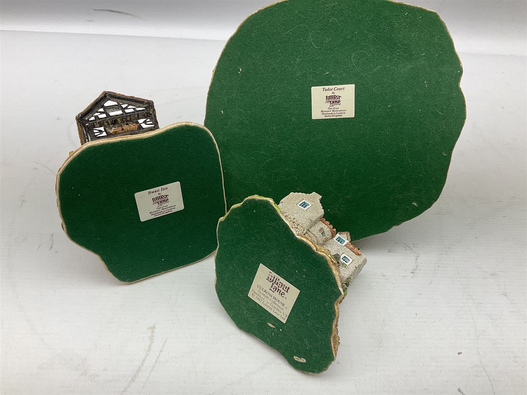 Eleven Lilliput Lane cottages from the British / English Collection, to include Tudor Court, Swan Inn, Culross House etc all boxed with deeds