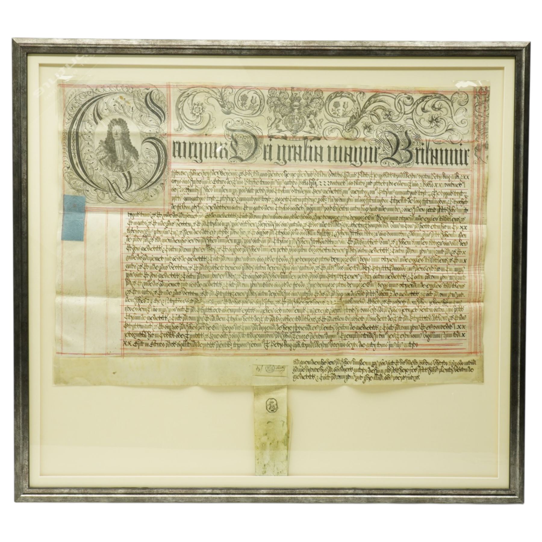 George I indenture on vellum in black ink with ornate headline and engraved portrait of George I, framed 85cm x 95cm overall